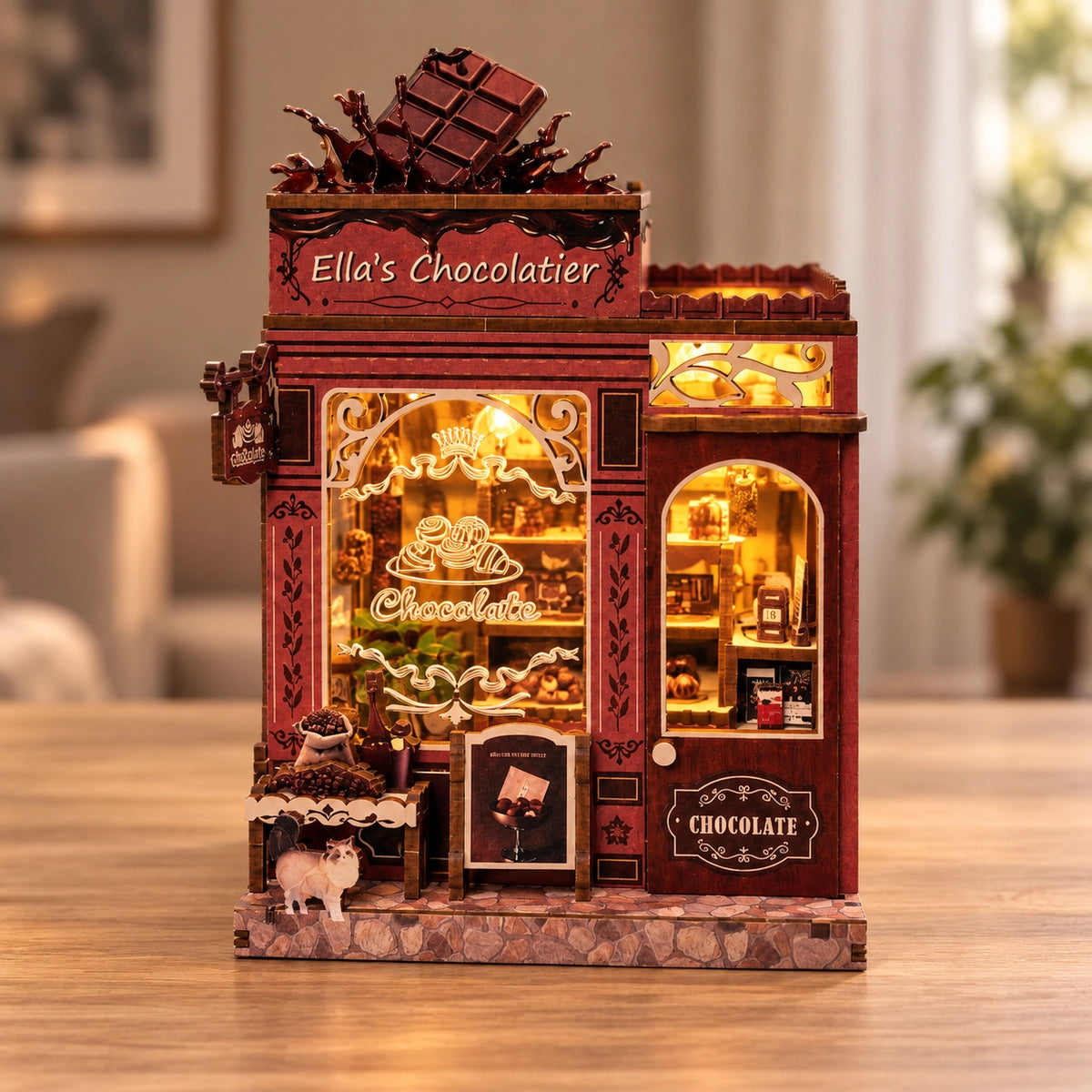 Ella's Chocolatier mit bordeauxroter Fassade und Schokoladentafel auf dem Dach