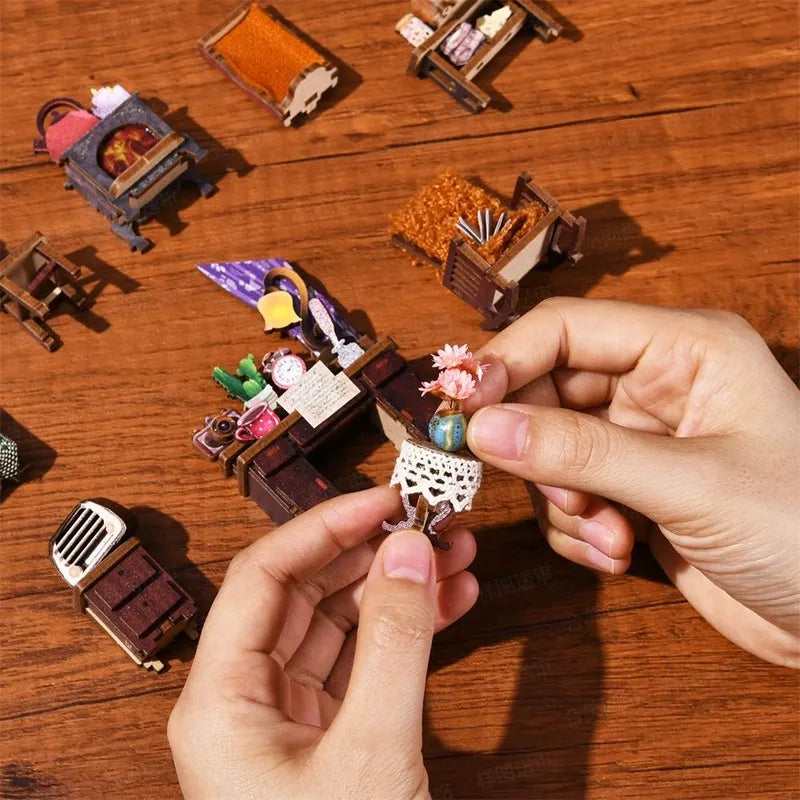 Montaggio delle miniature con vaso, tavoli, sedie e radio