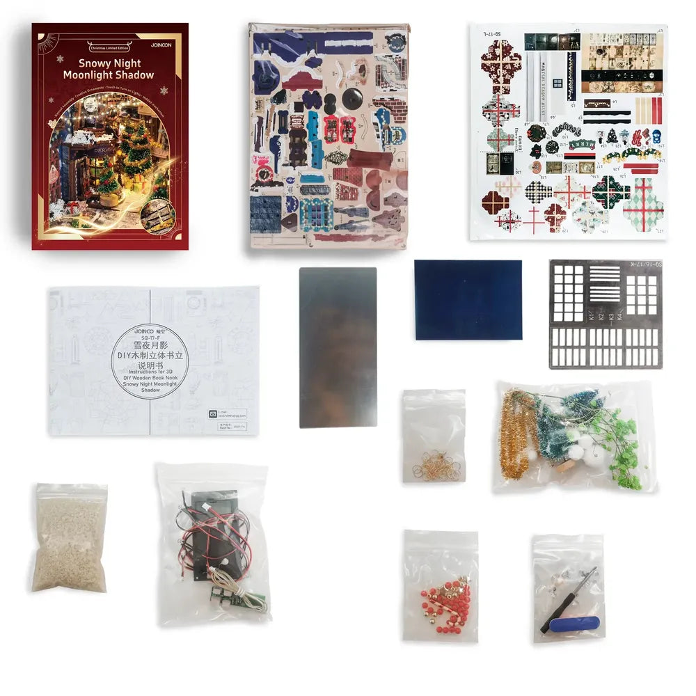 Componenti, decorazioni, pannelli trasparenti e istruzioni del kit natalizio