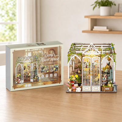 Demi's Flower House Bausatz neben der illustrierten Geschenkbox