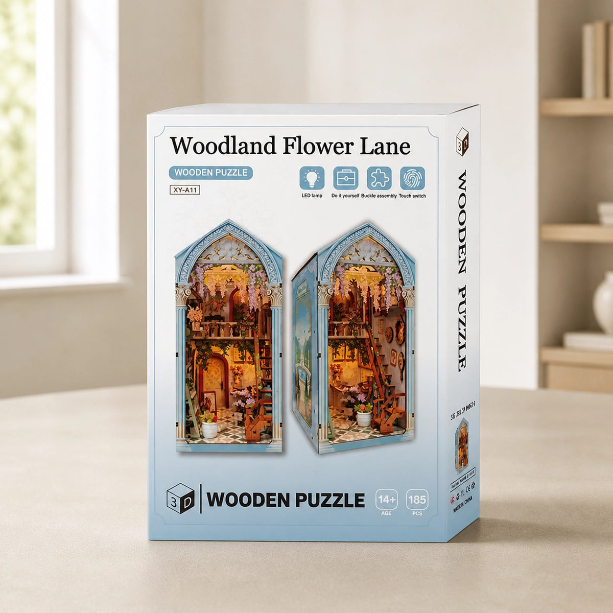 Woodland Flower Lane junto a la caja blanca ilustrada