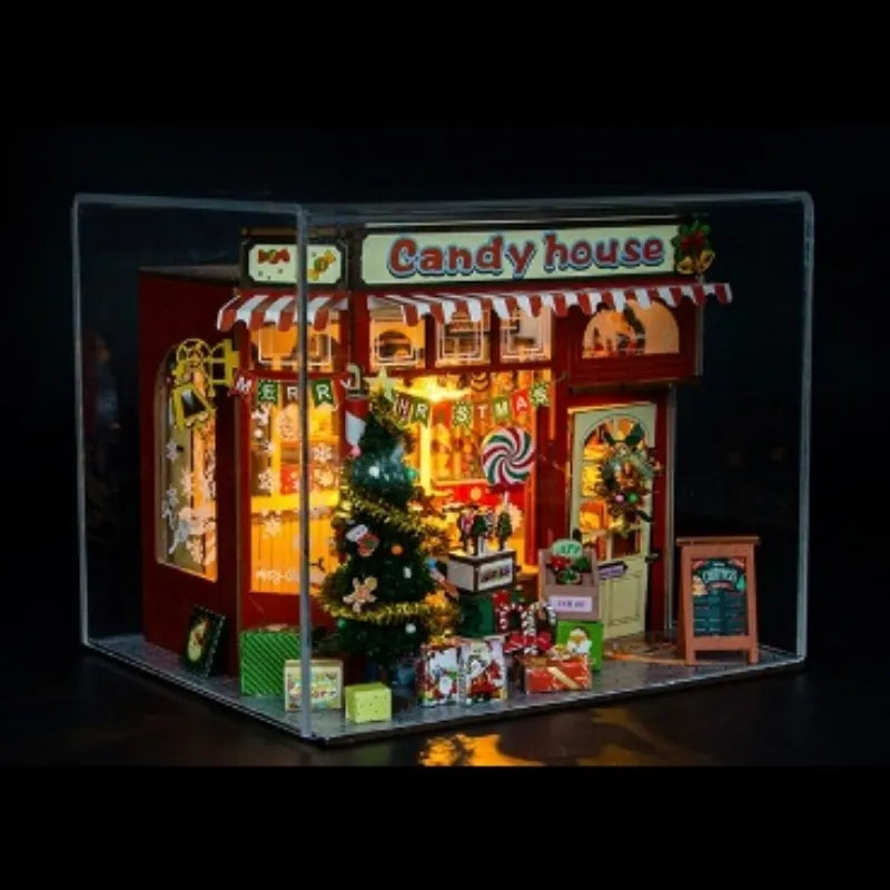 Miniatur Haus Bausatz - Candy House stimmungsvolle Beleuchtung in einem abgedunkelten Raum