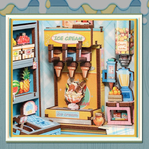 Waffelstation mit Toppingbehältern, Mixer und kleinen Fruchtkisten