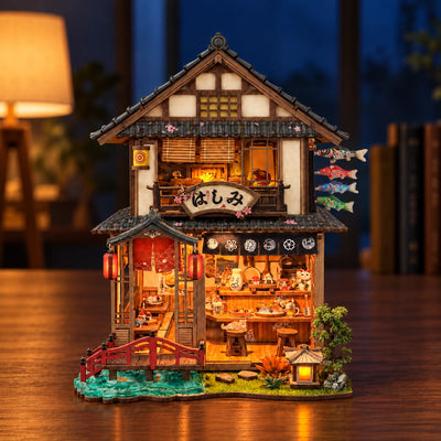 Illuminated frontage of Bridgeside Machiya in the evening