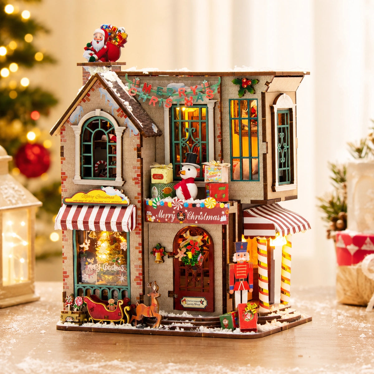 Enchanted Christmas Cottage illuminata con Candy Shop