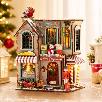 Enchanted Christmas Cottage illuminata con Candy Shop