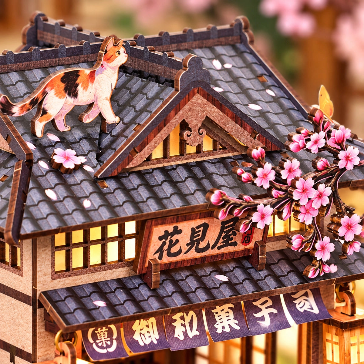 Rooftop cat and blossom above the shop sign