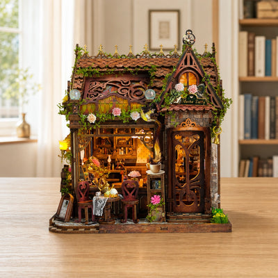 Mocha Diary with rose-covered roof and stained glass