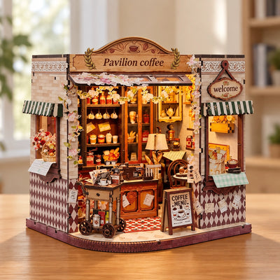 Pavilion Coffee mit offener Front und blumengeschmücktem Eingang