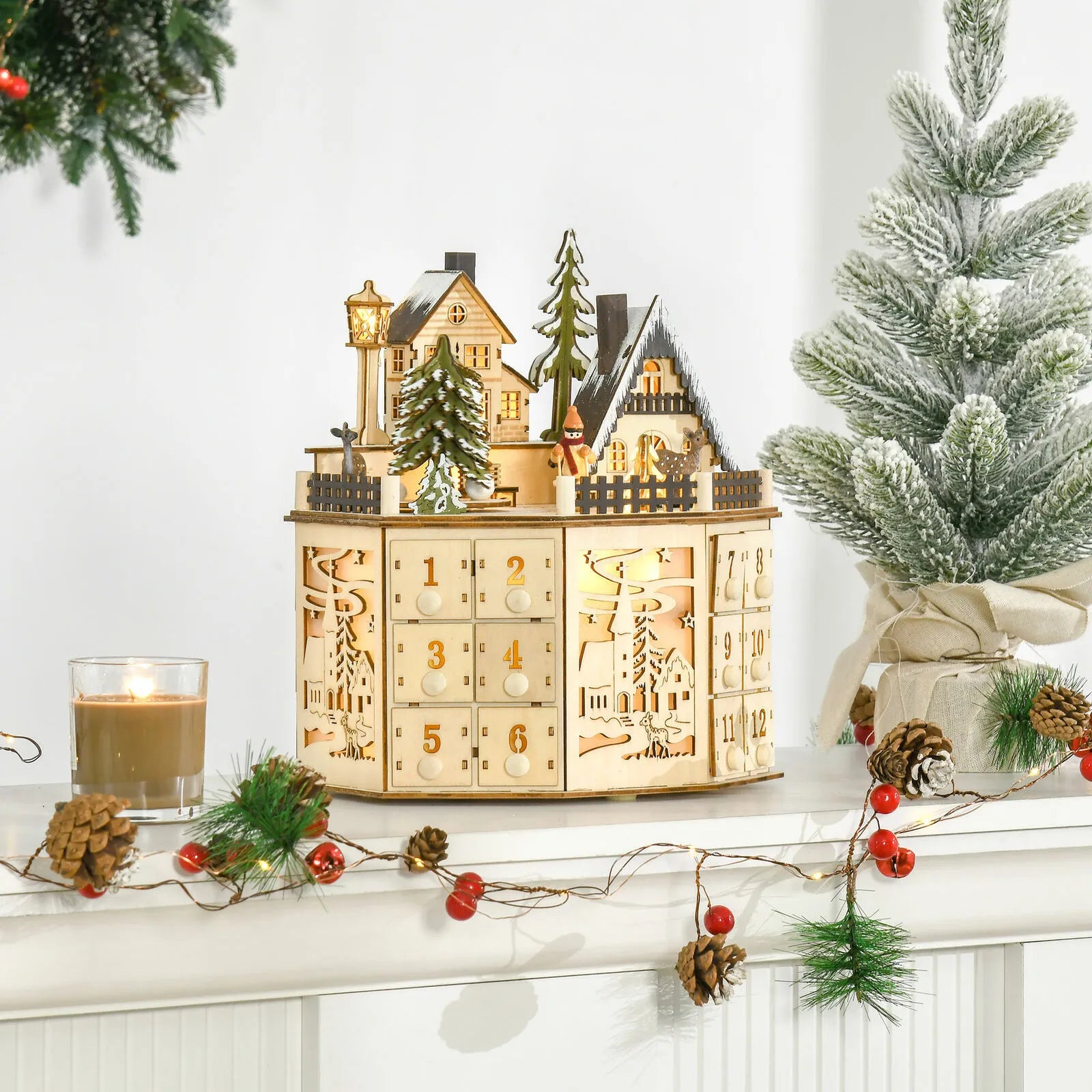 Weihnachtsdorf Adventskalender dekorativ auf einem Schreibtisch platziert